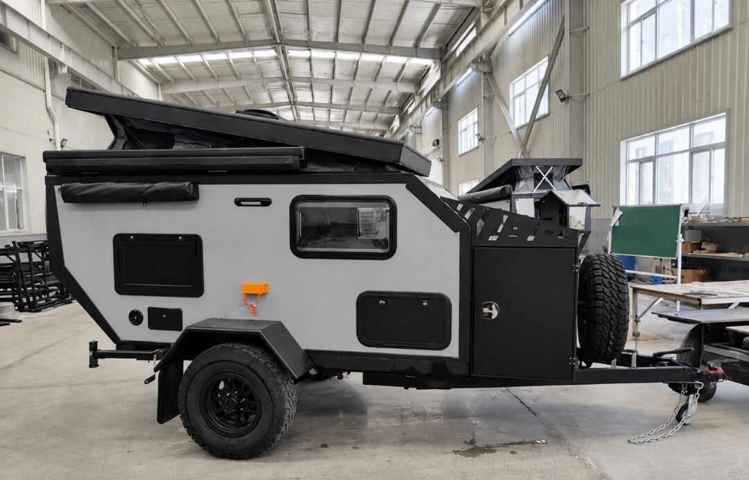 Camper side profile with the roof lowered